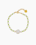 A bracelet of lustrous freshwater pearls, gently accented by vivid green seed beads for a fresh pop of color