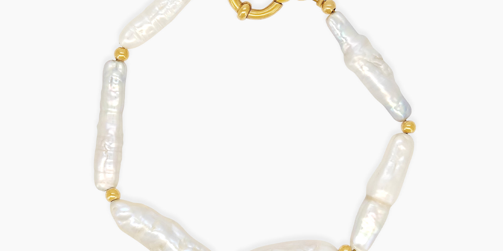 A bracelet of elongated baroque pearls with soft, iridescent sheen, accented by delicate gold-toned beads
