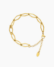 A bracelet in style A featuring geometric links in a rich gold-tone finish with an adjustable chain