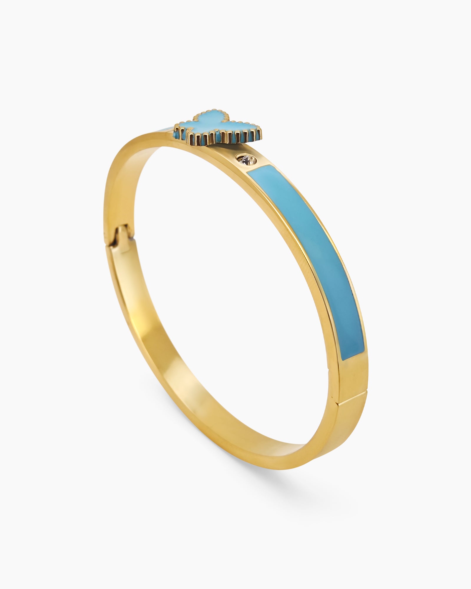 A blue hinged bangle with a sleek gold-tone design, vibrant enamel band, and a butterfly centerpiece