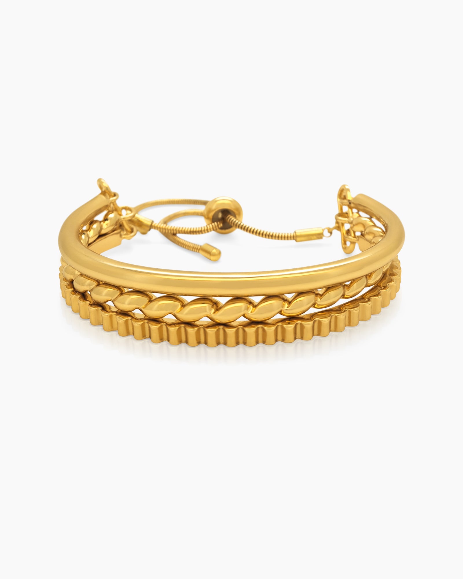 A gold-tone bracelet with the look of three in one: a smooth band, twisted rope, and a textured chain