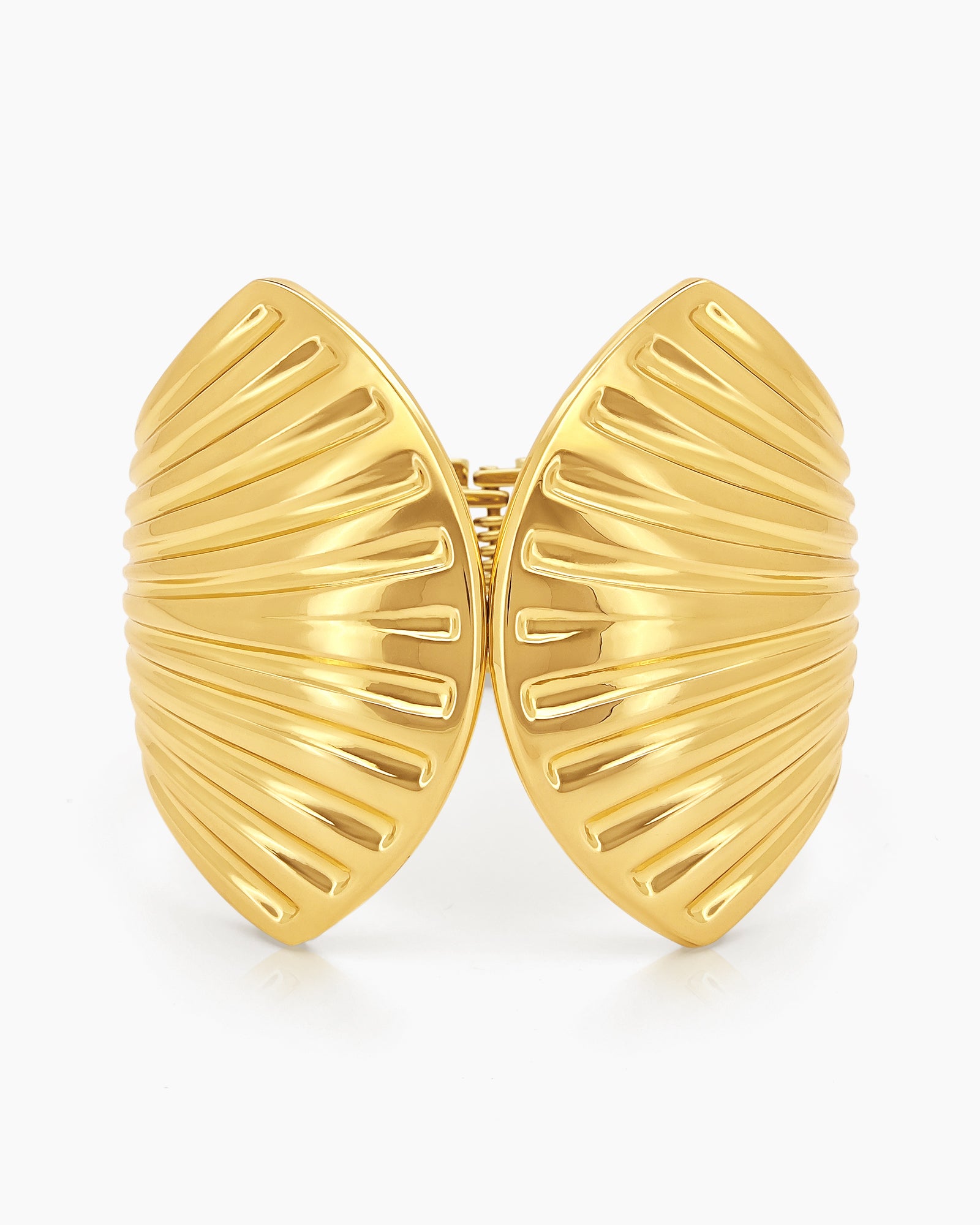 A polished gold hinged bangle sculpted with flowing, shell-inspired ridges for a bold, statement look