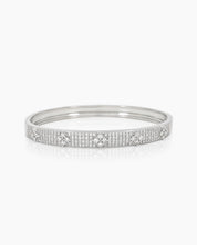 A silver bangle with a sleek silhouette, adorned with pavé-set crystals and brilliant clear zircons