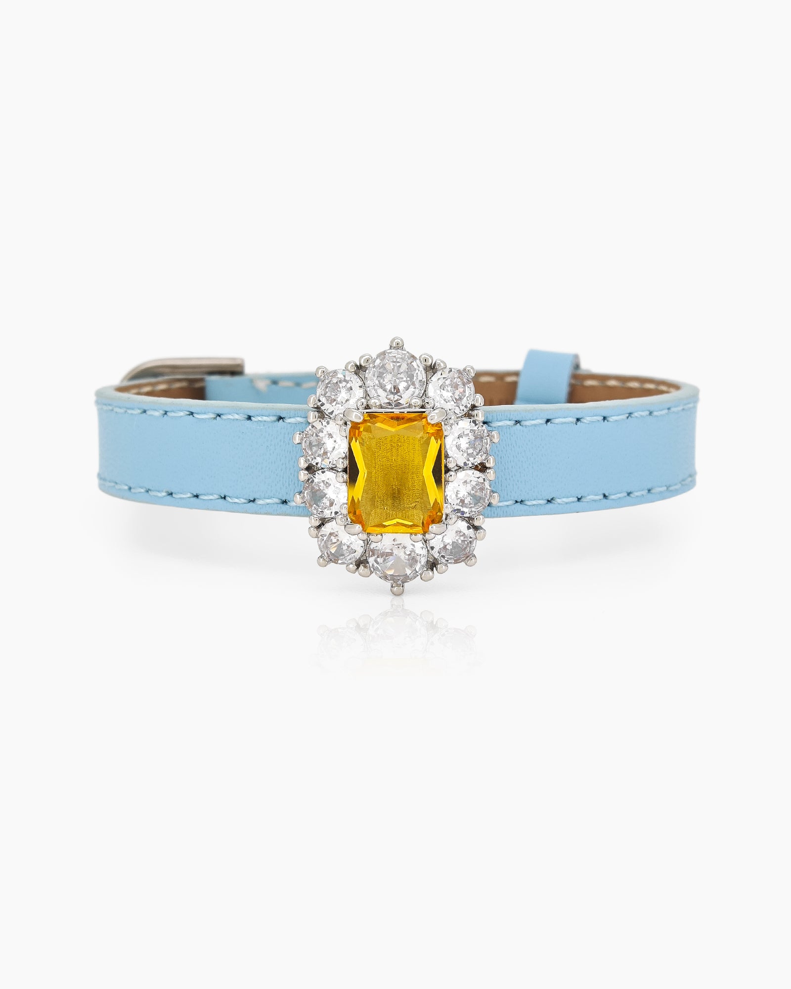 A blue-yellow vintage-inspired bracelet with a dazzling center stone surrounded by radiant zircon accents