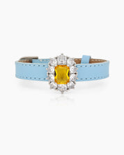 A blue-yellow vintage-inspired bracelet with a dazzling center stone surrounded by radiant zircon accents