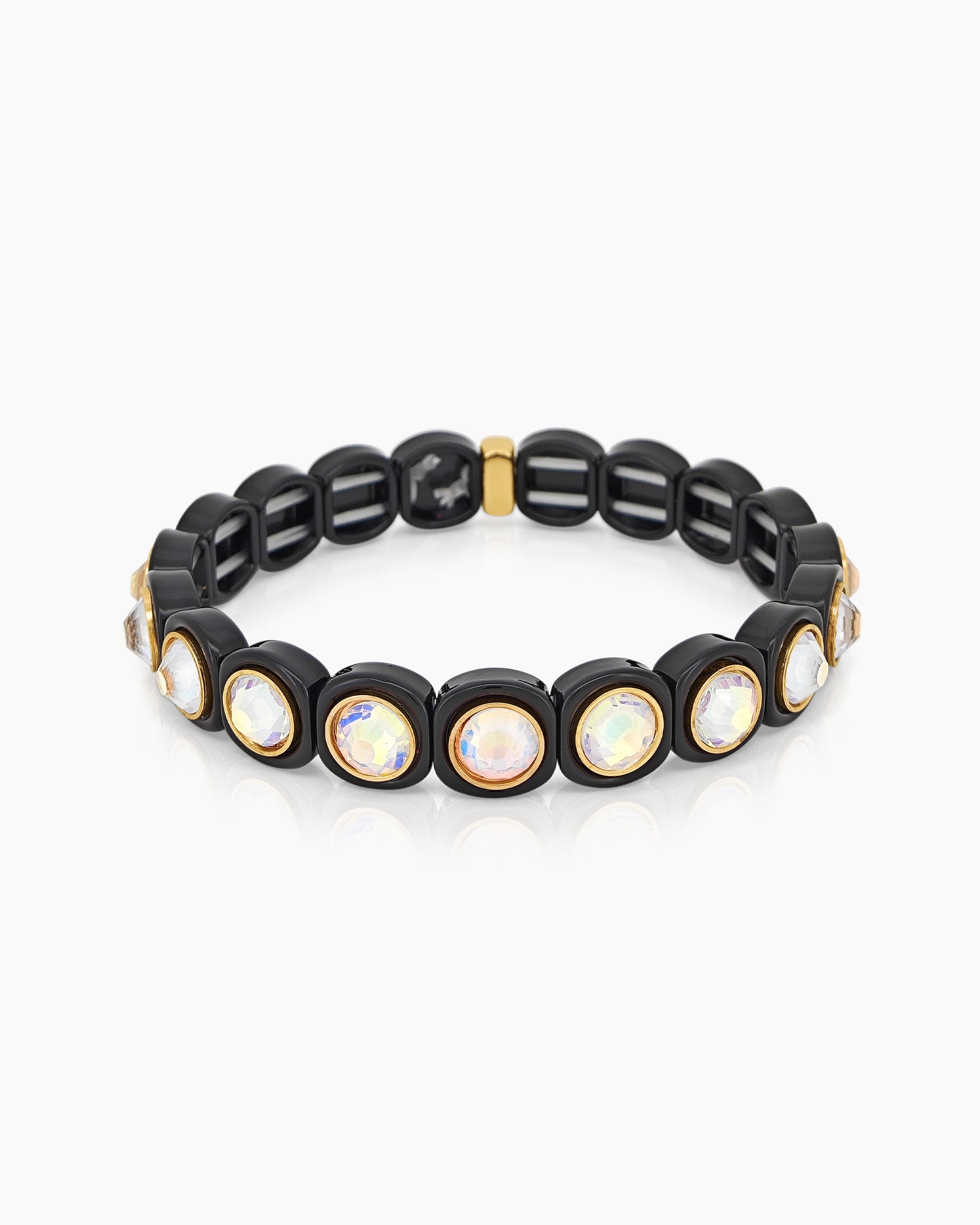 A black-white stretch bracelet with glossy links set with iridescent crystal stones for a playful flair