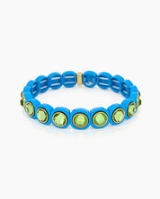 A blue-green stretch bracelet with glossy links set with iridescent crystal stones for a playful flair