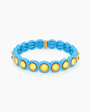 A blue-yellow stretch bracelet with glossy links set with iridescent crystal stones for a playful flair
