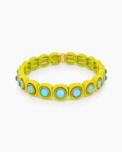 A lime-blue stretch bracelet with glossy links set with iridescent crystal stones for a playful flair