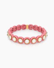 A pink-white stretch bracelet with glossy links set with iridescent crystal stones for a playful flair