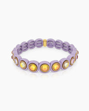 A purple-orange stretch bracelet with glossy links set with iridescent crystal stones for a playful flair