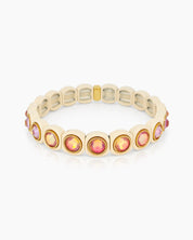 A white-pink stretch bracelet with glossy links set with iridescent crystal stones for a playful flair