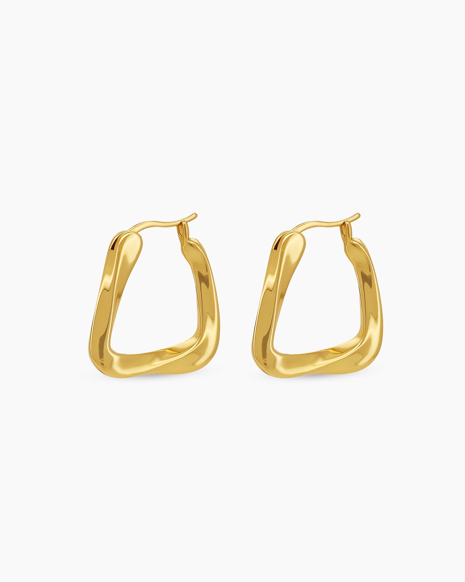 Gold hoop earrings with a bold triangular shape, softly rounded edges, and a high-shine finish