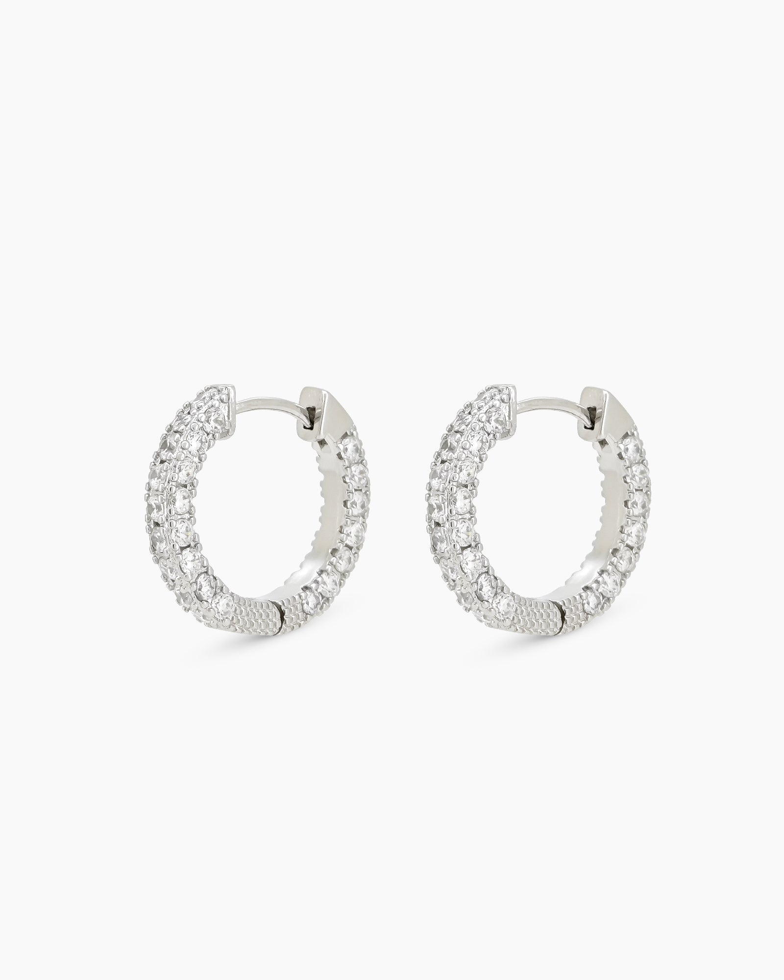 Chunky platinum-white hoops with two radiant rows of pavé-set zircons for dazzling, daily glam