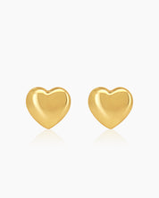 Puffed heart stud earrings with a smooth, softly rounded silhouette and a modern, glossy gold-tone finish