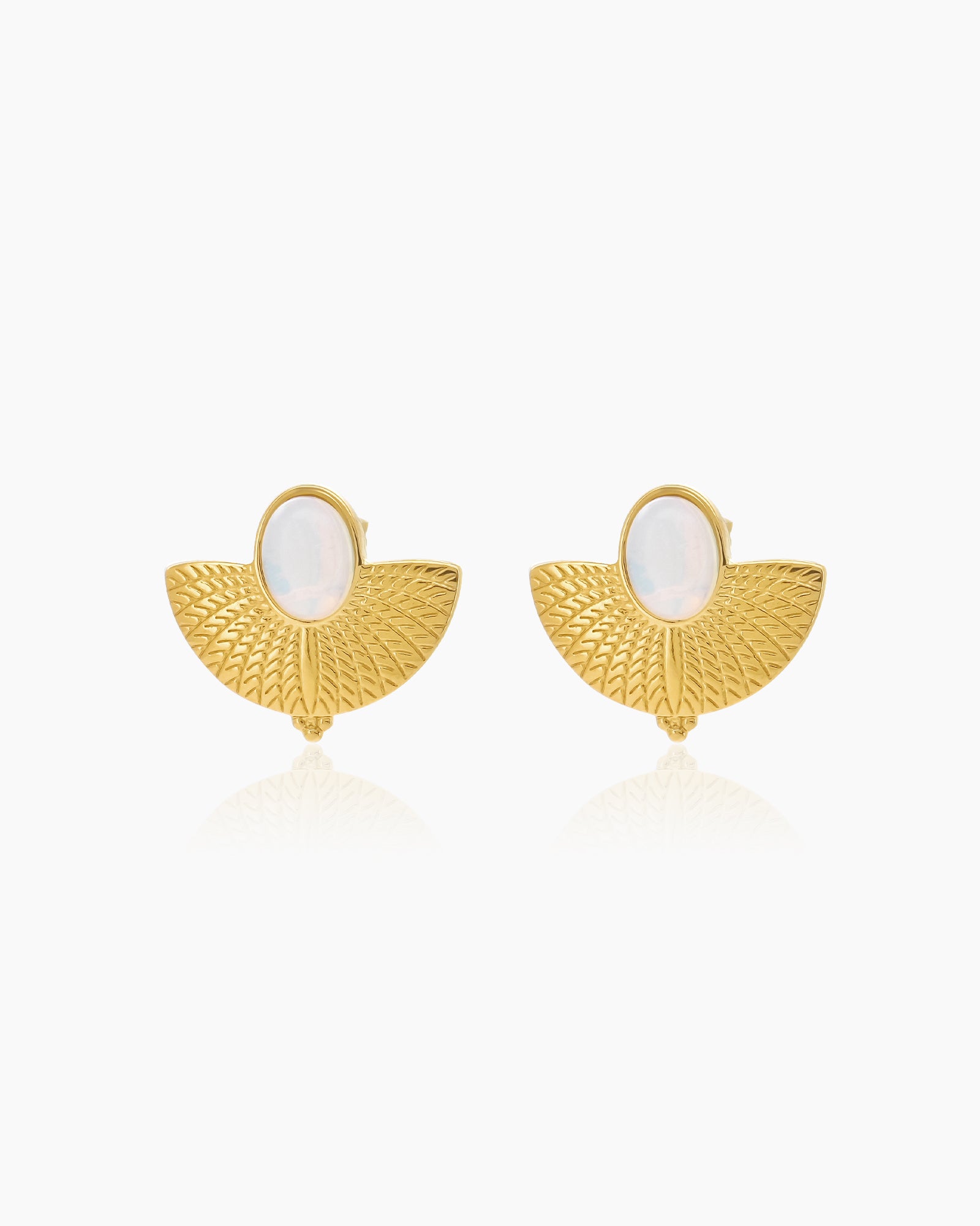 Earrings that pair a dreamy, iridescent opal stone with a wide, etched fan base in polished gold