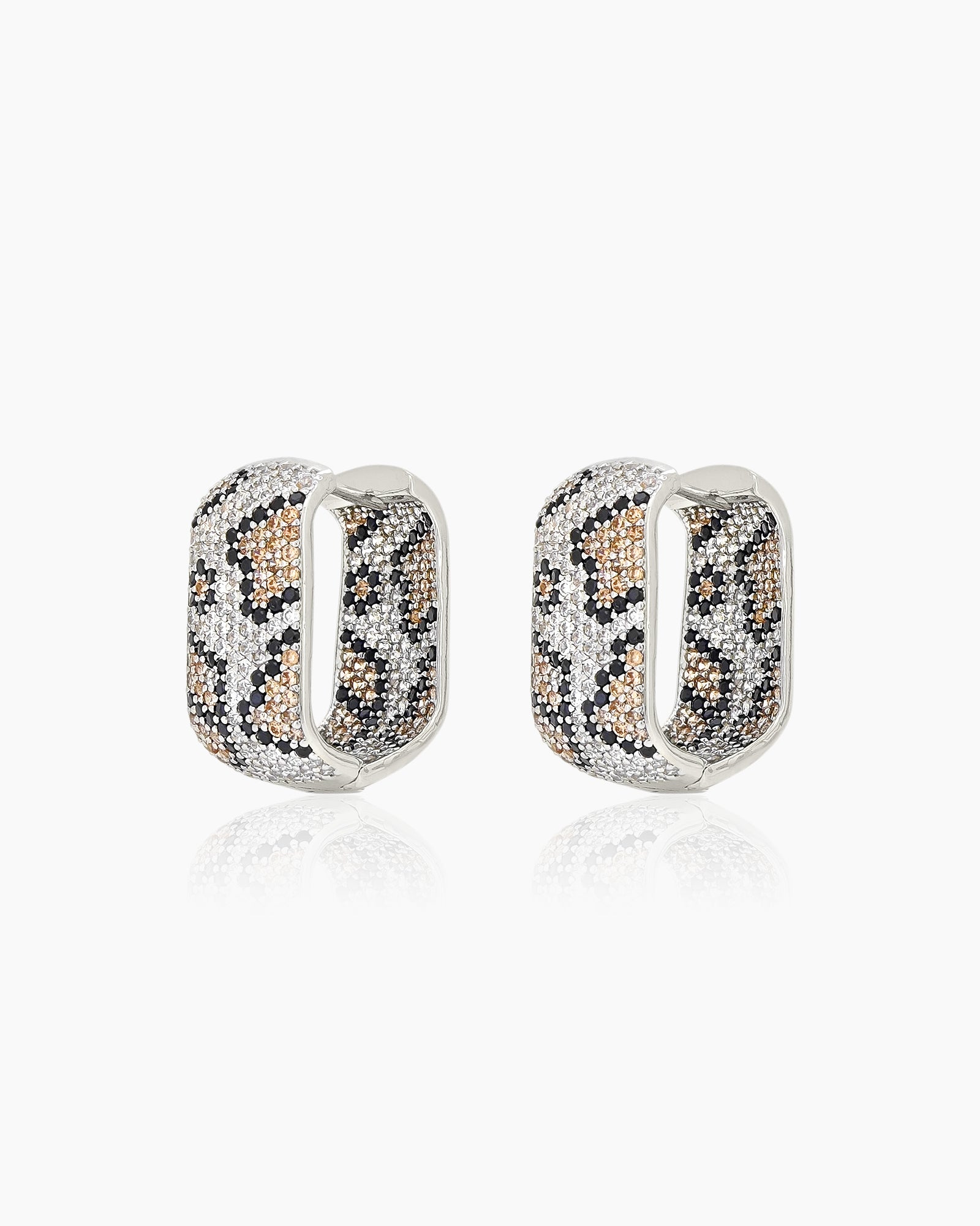 Silver-tone hoops with a sculptural silhouette, encrusted with pavé zircons in a glamorous leopard print