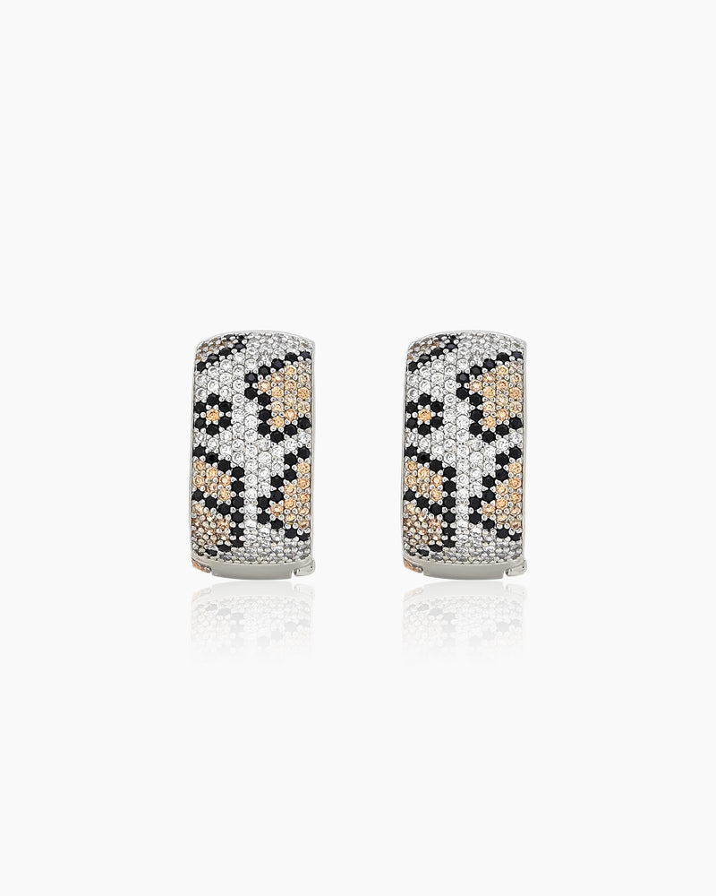 Silver-tone hoops with a sculptural silhouette, encrusted with pavé zircons in a glamorous leopard print