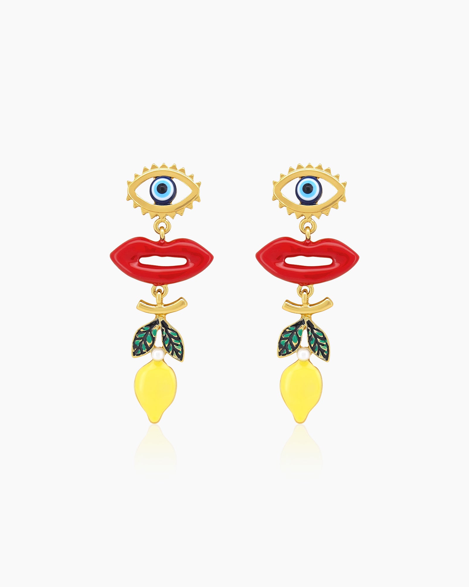 Maximalist earrings with a spiky evil-eye stud, glossy red lips, and a dangling lemon charm