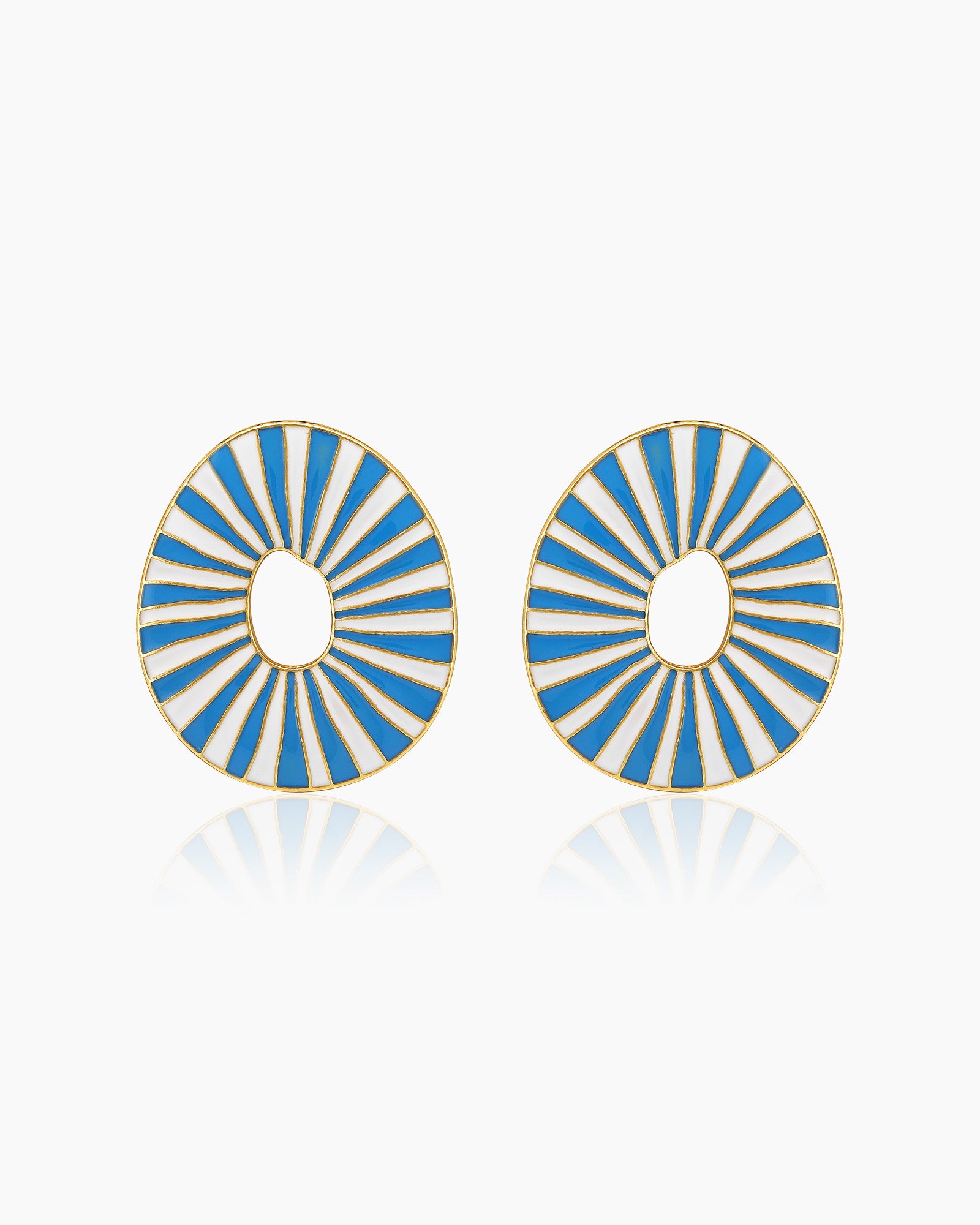 Light-blue oval earrings with radiant enamel stripes in a sunburst pattern for a retro glamour look