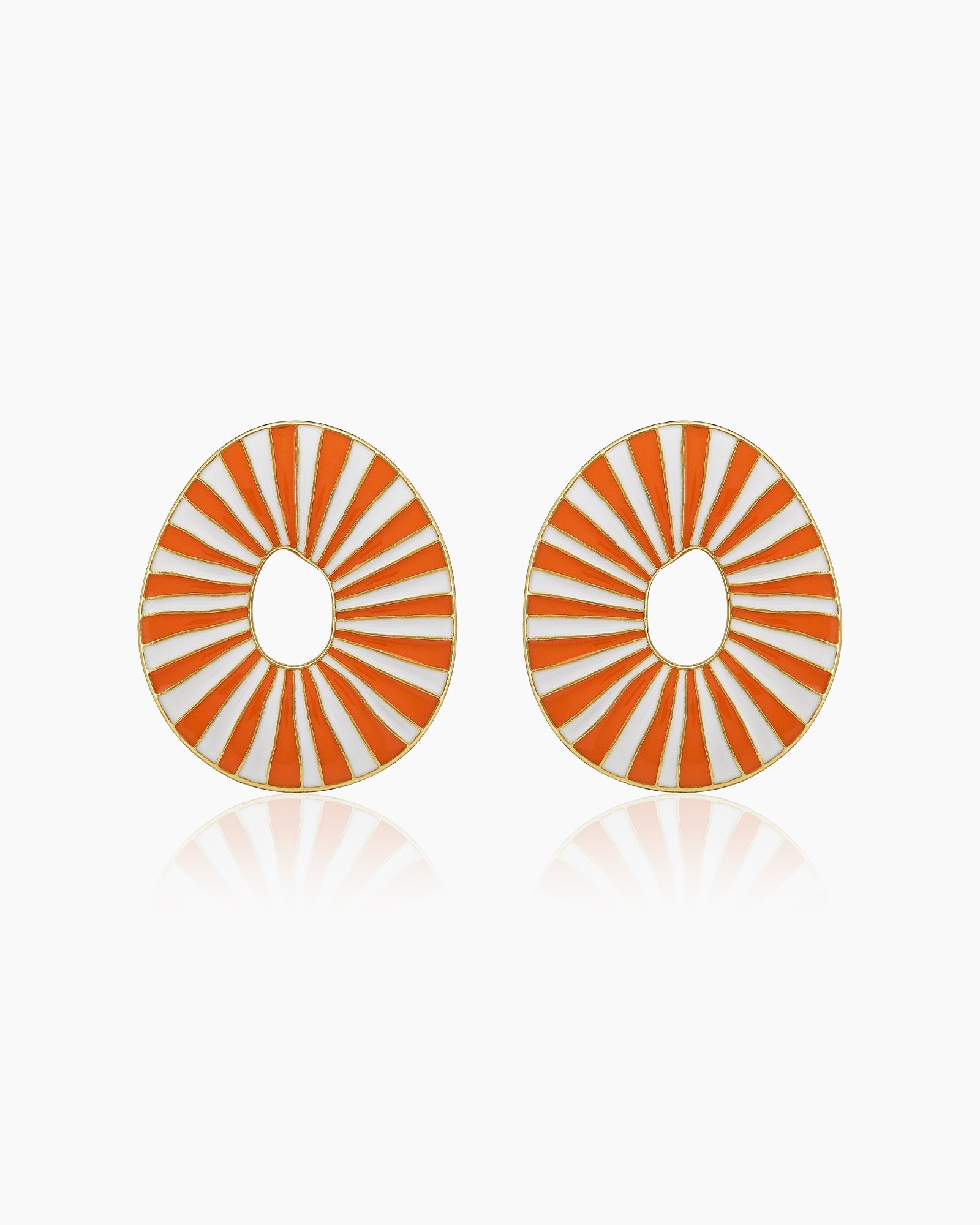Orange oval earrings with radiant enamel stripes in a sunburst pattern for a retro glamour look