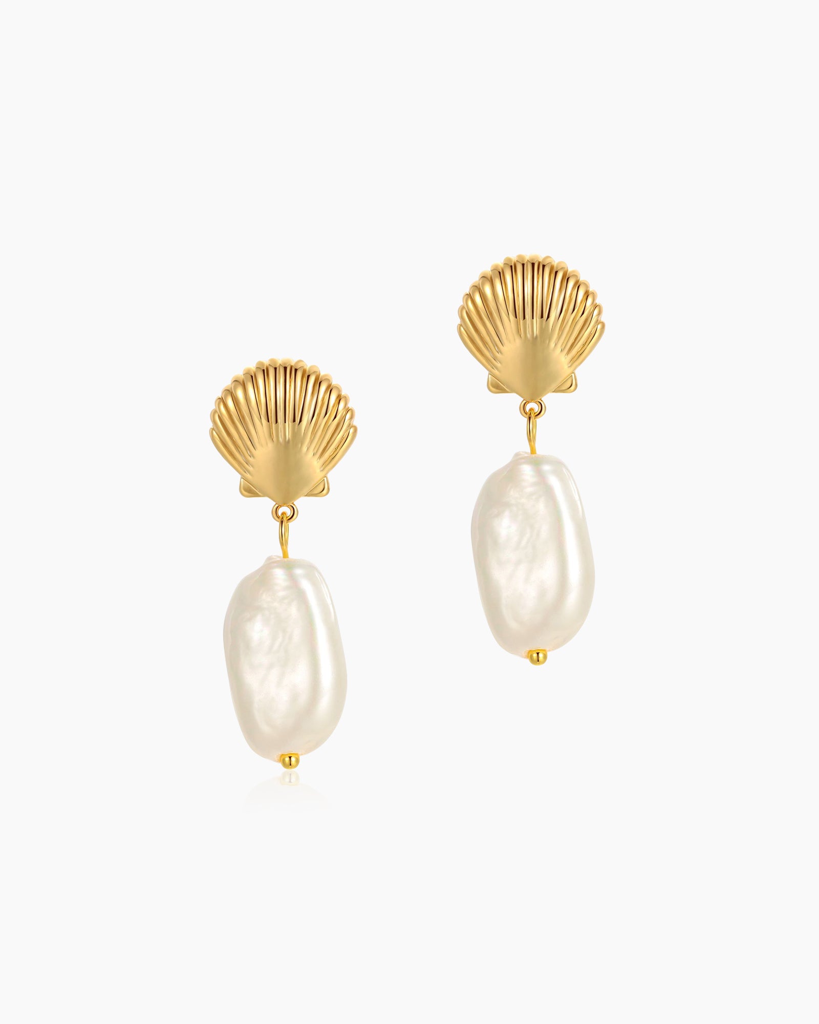 Earrings with a gleaming gold shell stud and a modern, organic baroque freshwater pearl drop