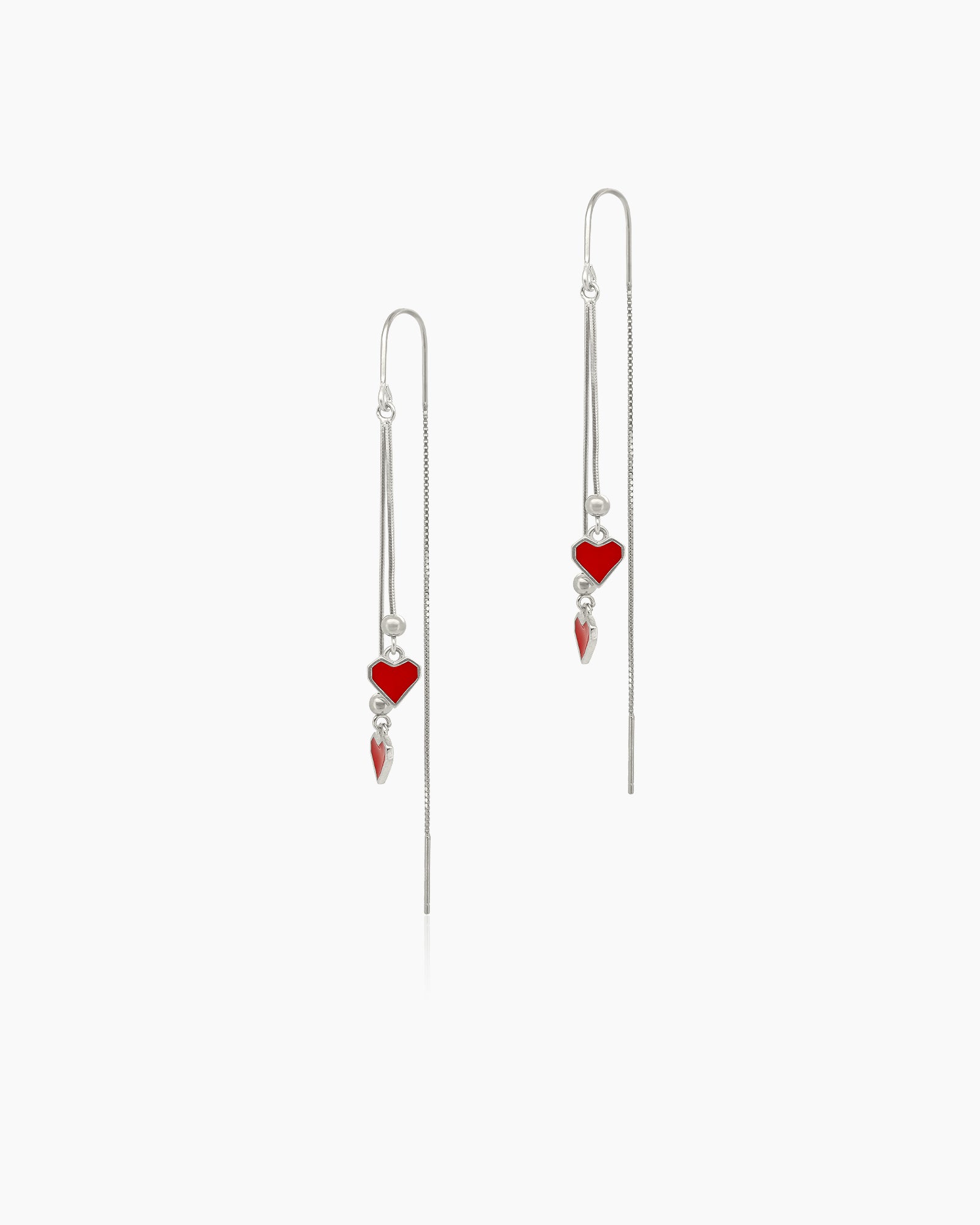 Threader earrings with two silver-toned chains and shiny red enamel hearts that sway with movement