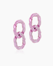 Glamorous pink earrings with oversized interlocking links and a high-shine, mirror-like finish