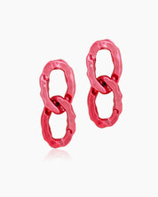 Glamorous red earrings with oversized interlocking links and a high-shine, mirror-like finish