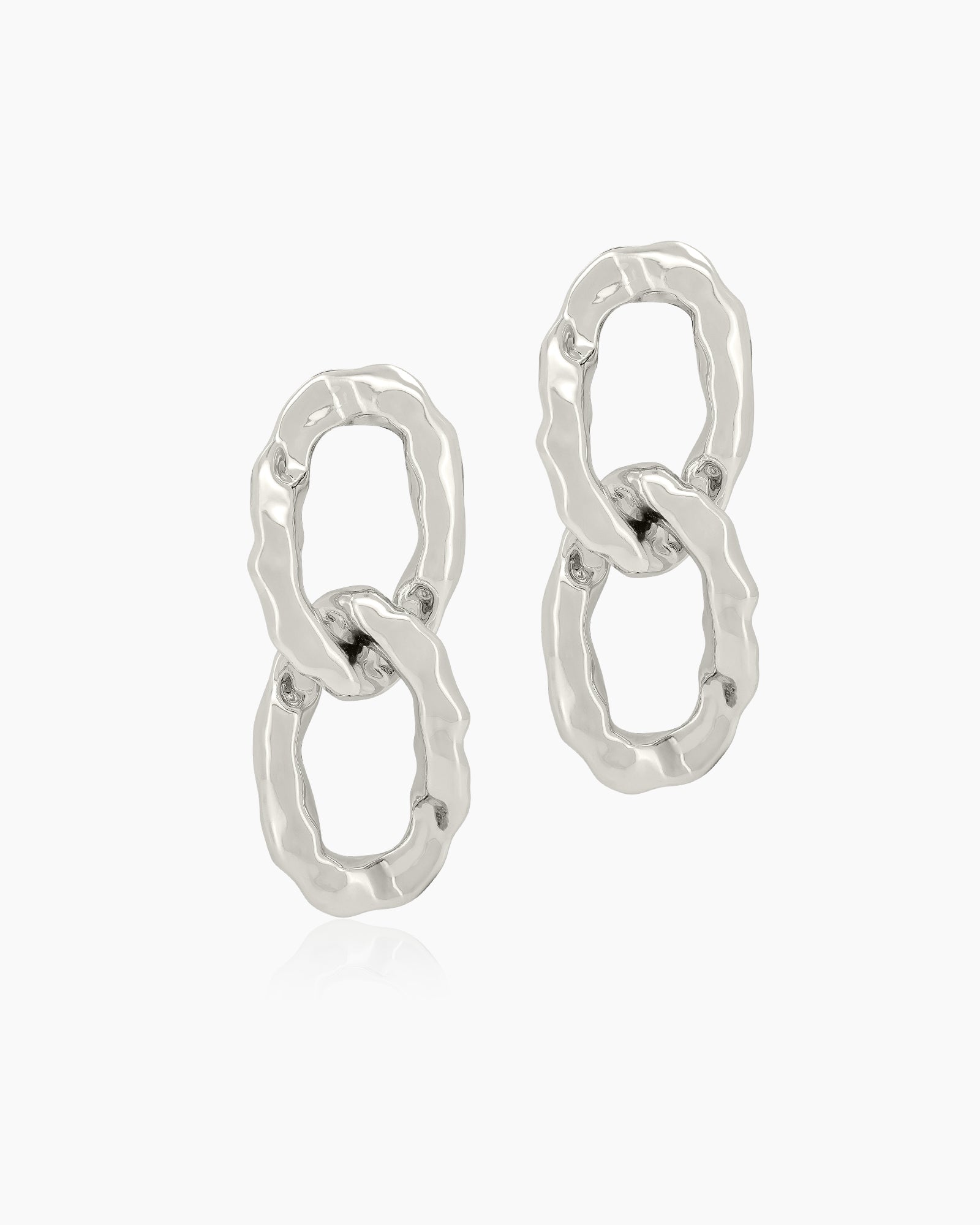 Glamorous gold earrings with oversized interlocking links and a high-shine, mirror-like finish