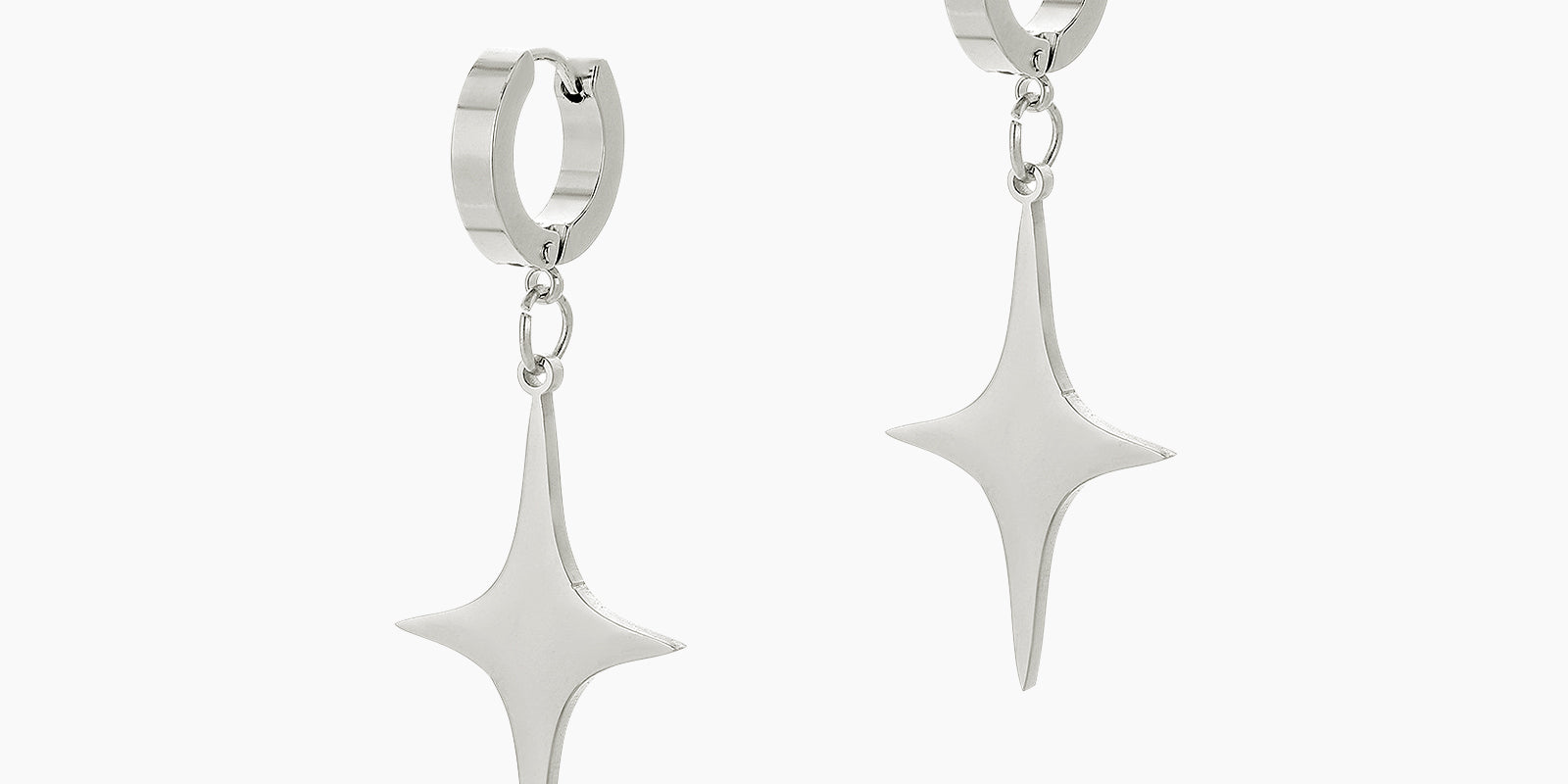 Silver drop earrings with sleek, elongated star drops dangling from polished huggie hoops