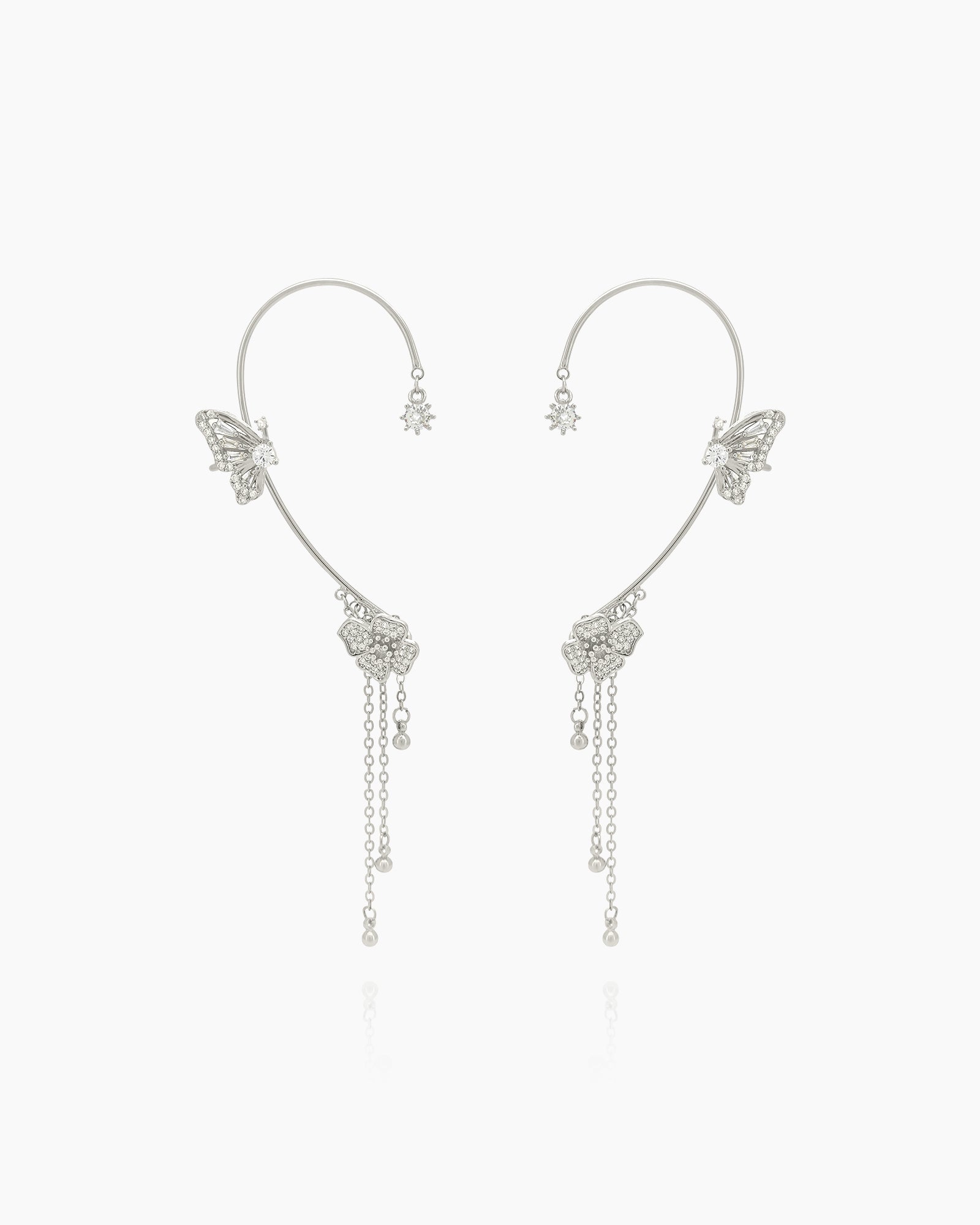 A trio of sparkling butterflies and soft chains that drape across the ear for a delicate, magical touch