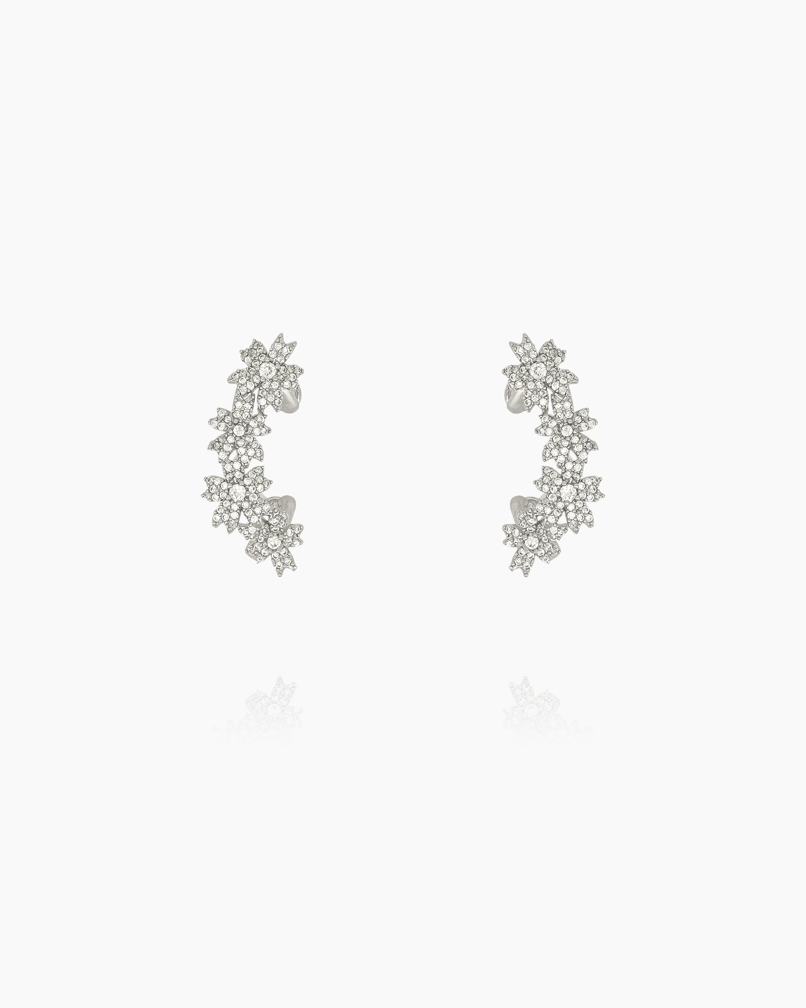Ear cuffs with shimmering zircon blossoms, designed to hug the curve of the ear for a sparkling look