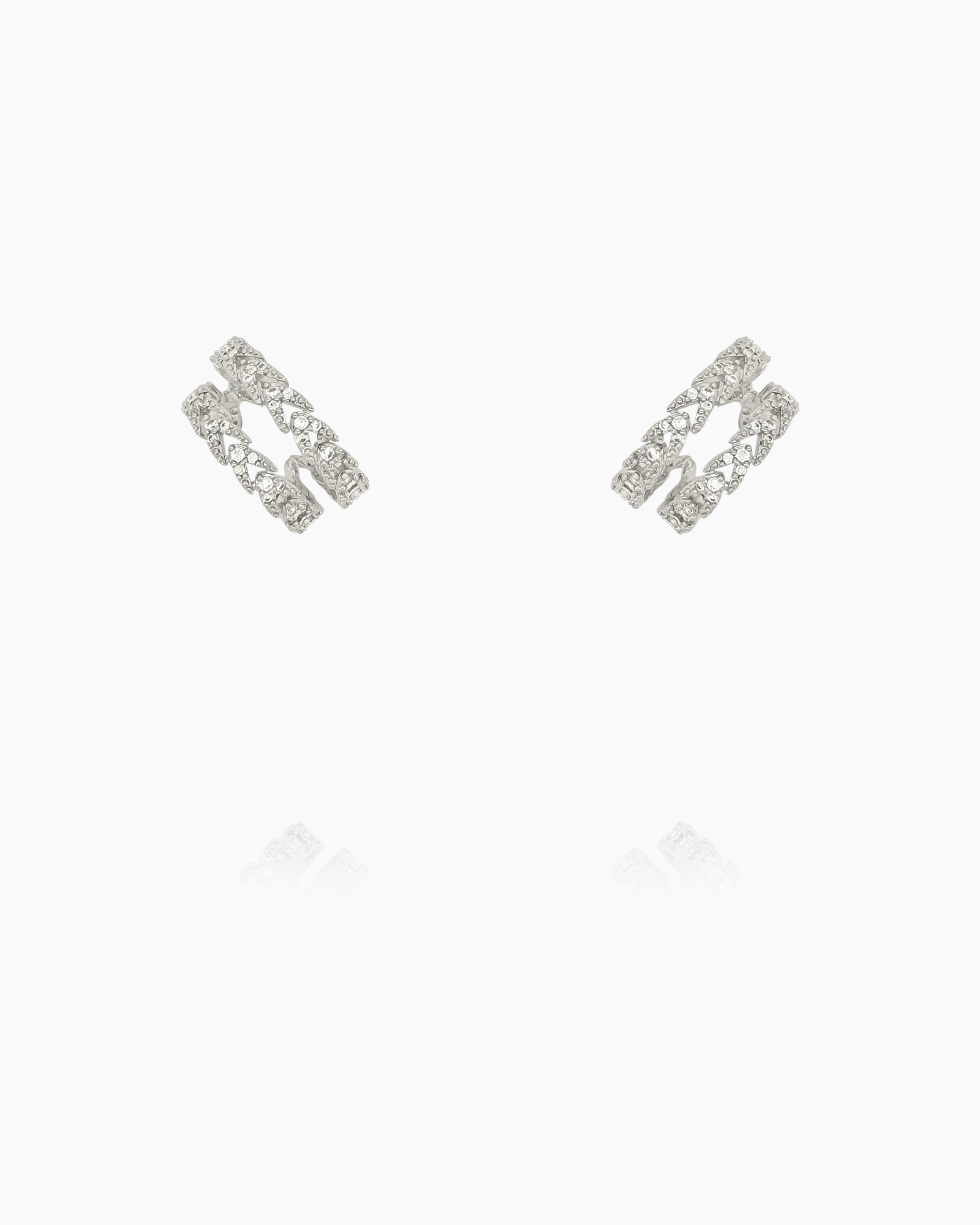 Ear cuffs that create a double hoop illusion, encrusted with a row of arrow-shaped zircons