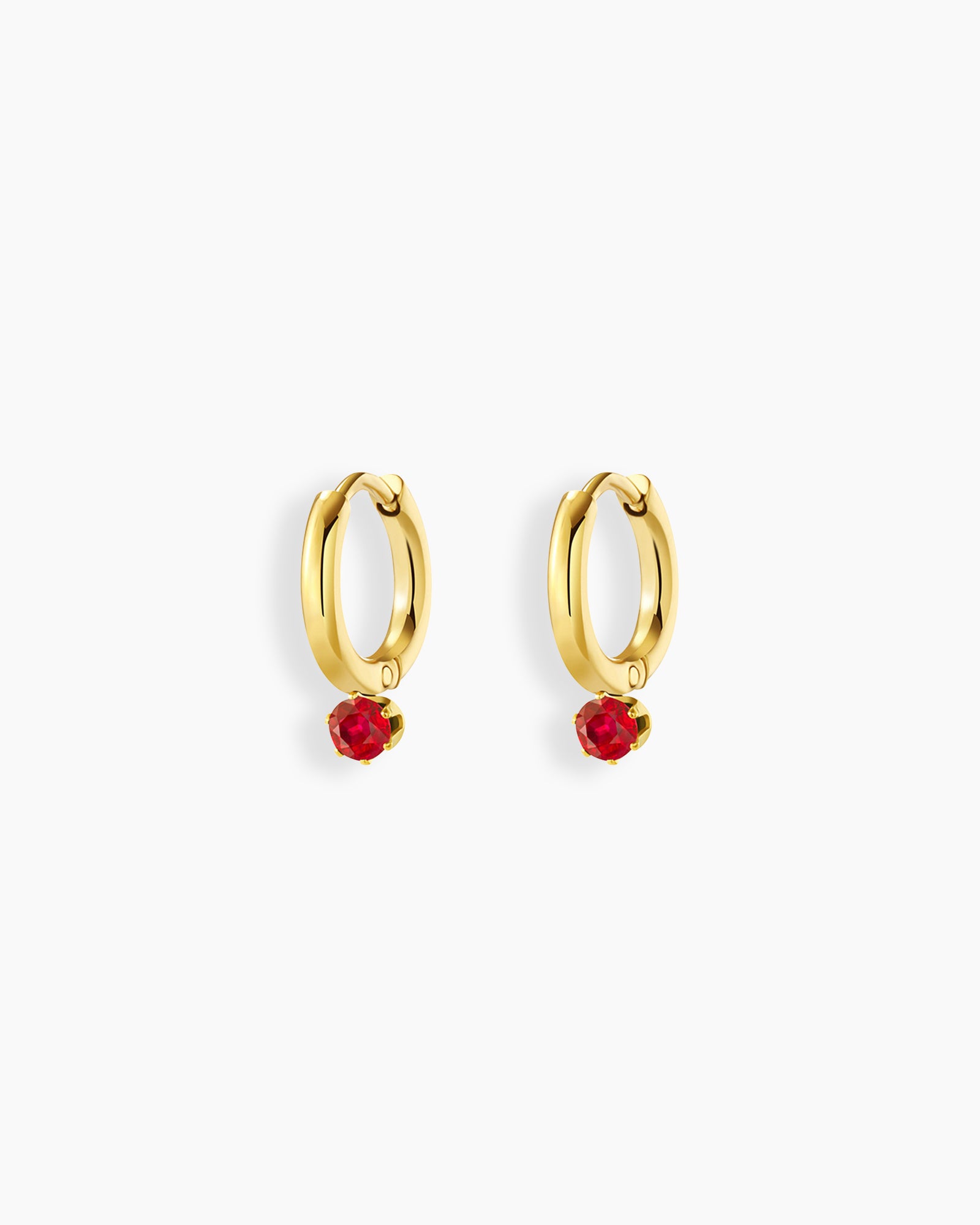 Huggie hoops with a polished gold-tone finish and a dazzling ruby-red zircon drop