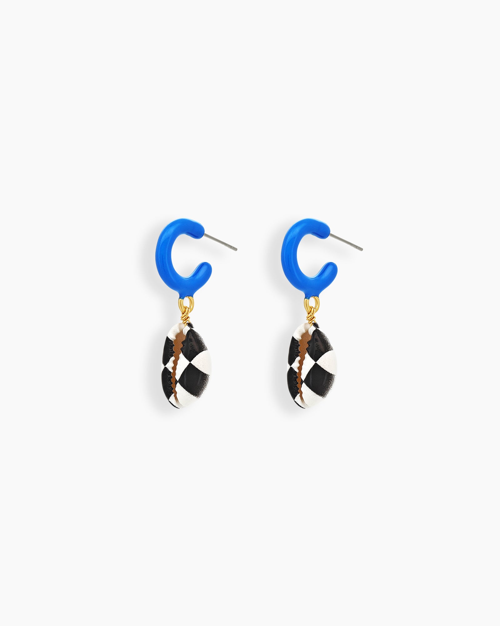 Statement earrings with a glossy cobalt blue hoop and a black-and-white hand-painted shell drop