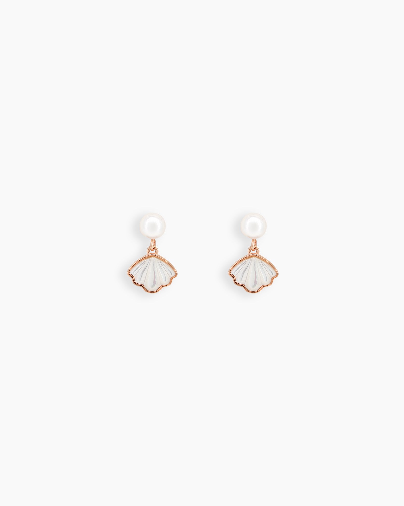 Earrings with a luminous pearl stud anchoring a scallop-shaped mother-of-pearl shell framed in rose gold