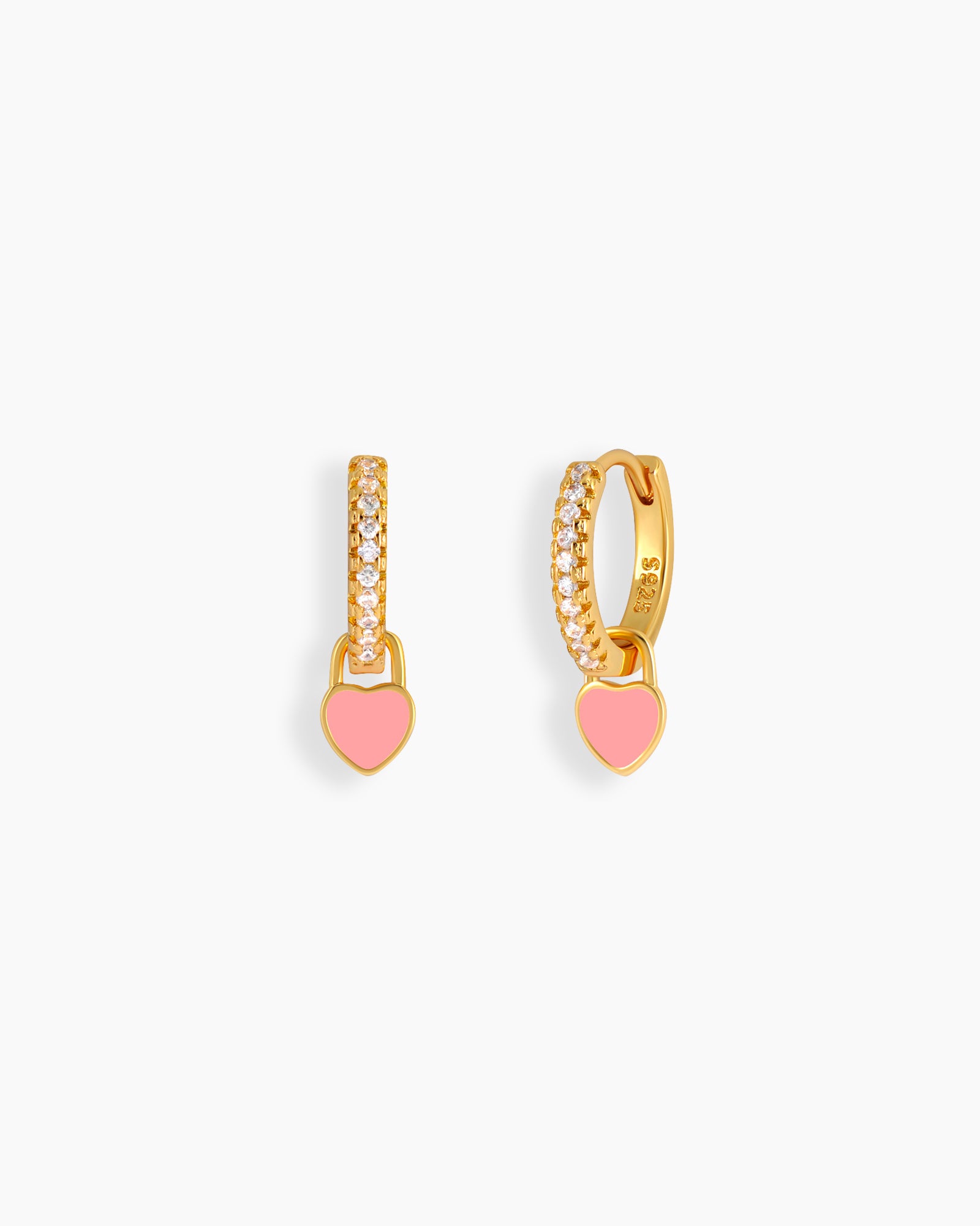 Pink drop earrings with a zircon-encrusted huggie and a glossy enamel heart charm that swings with movement