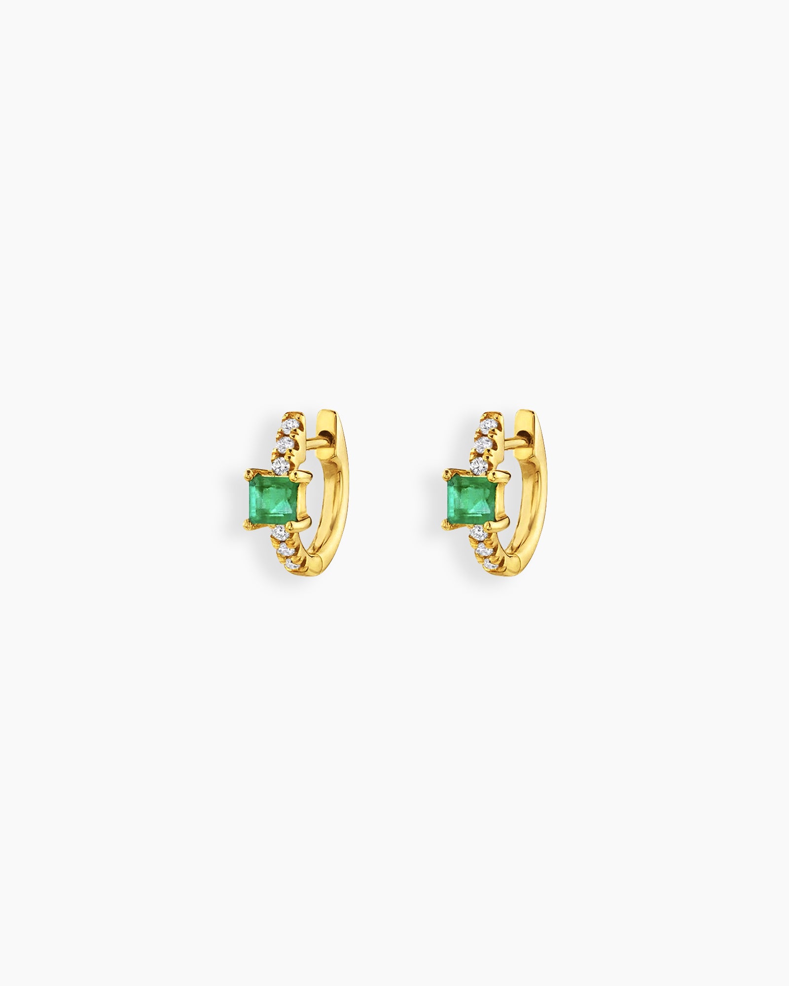 Green huggie earrings with a sleek gold-tone hoop, a baguette-cut center stone, and a delicate arc of pavé