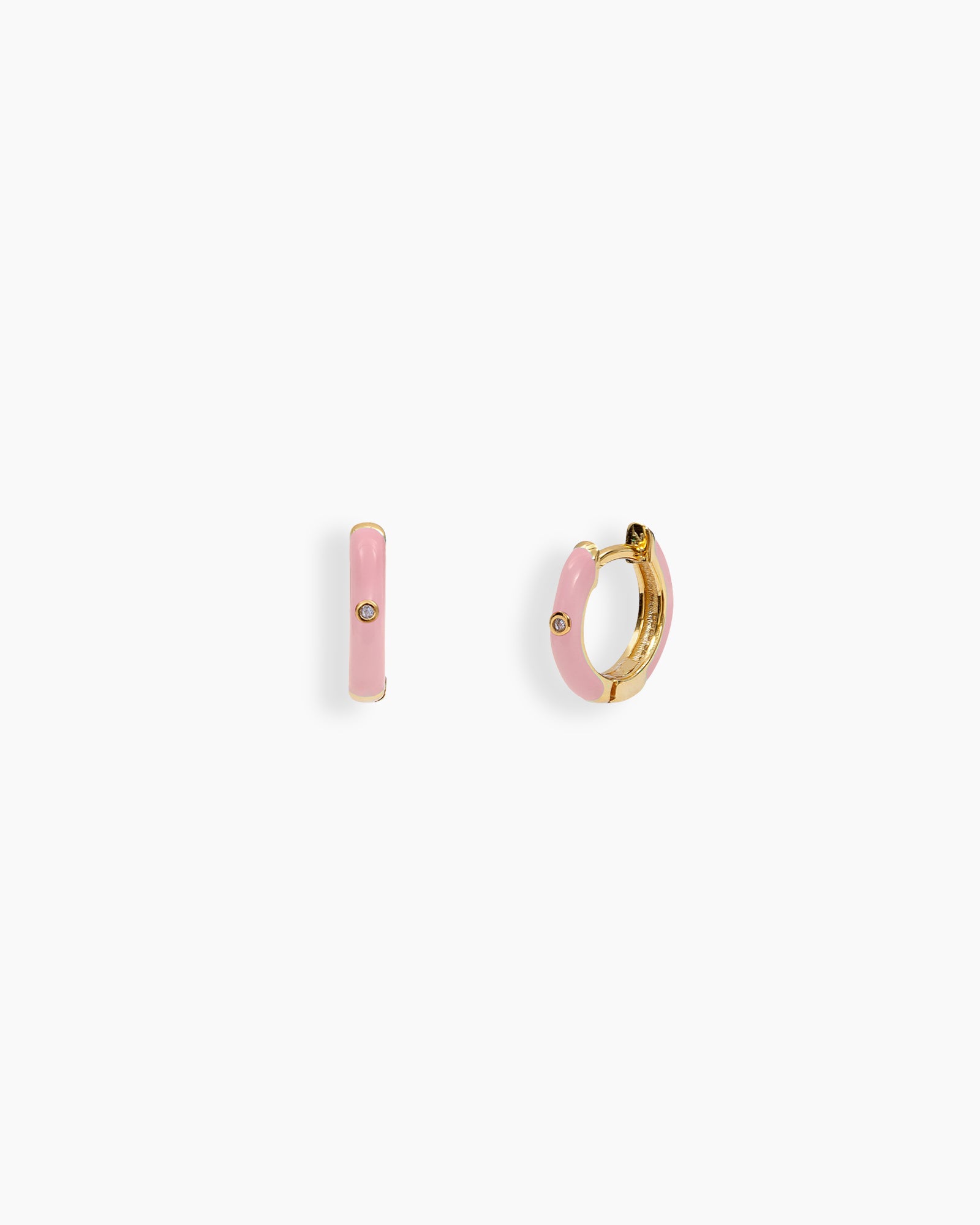 Pink mini hoops coated in glossy enamel and accented with a single sparkling zircon for a playful twist