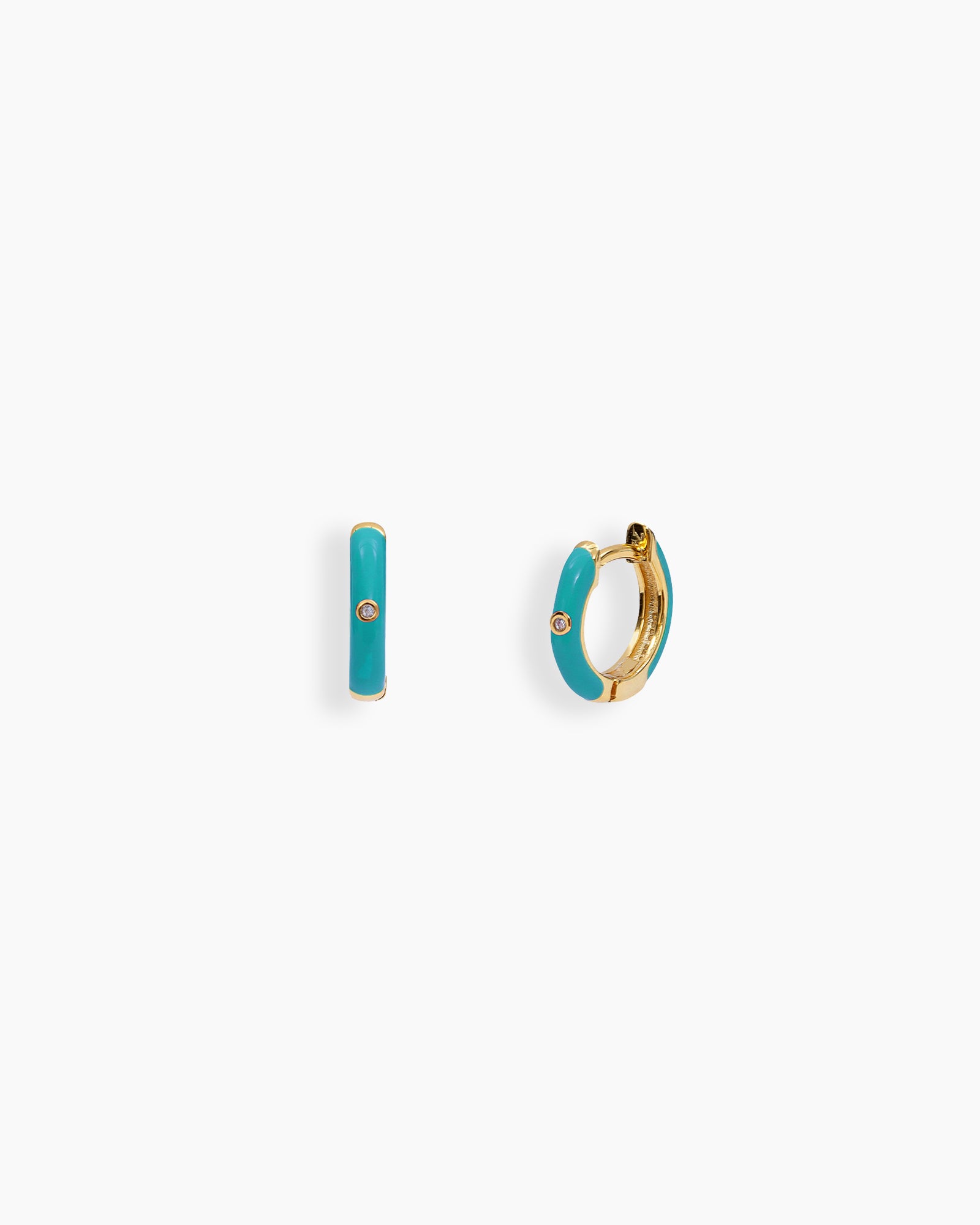 Turquoise mini hoops coated in glossy enamel and accented with a single sparkling zircon for a playful twist
