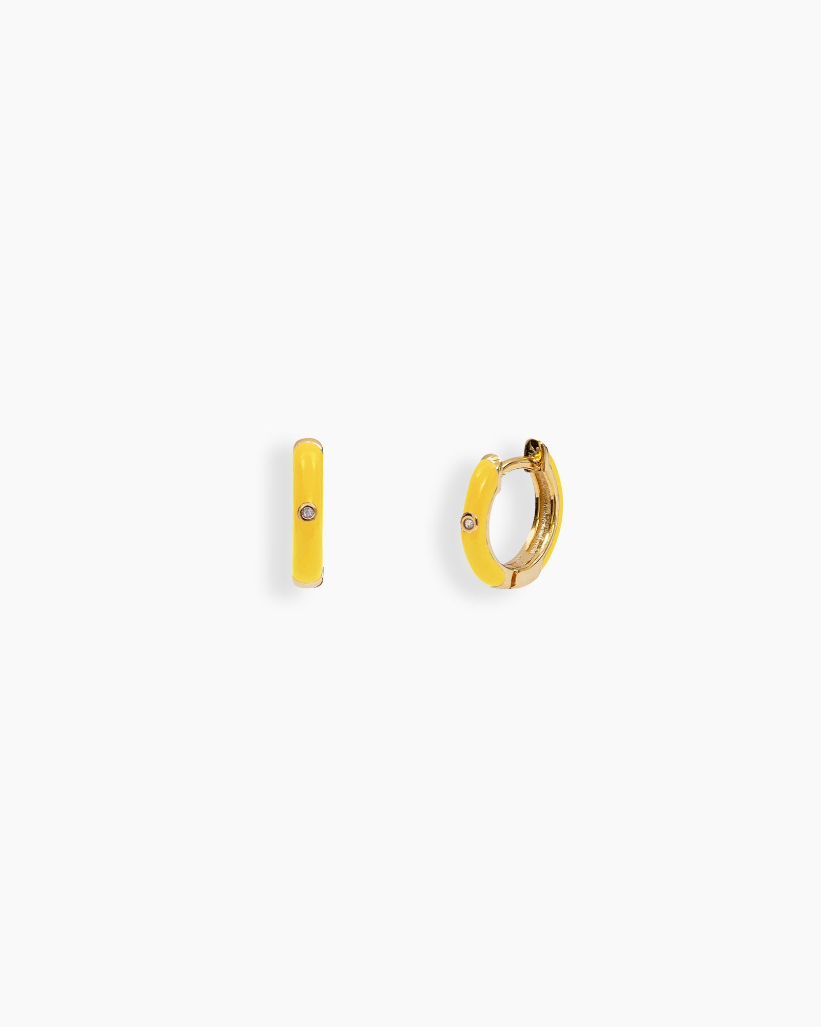 Yellow mini hoops coated in glossy enamel and accented with a single sparkling zircon for a playful twist
