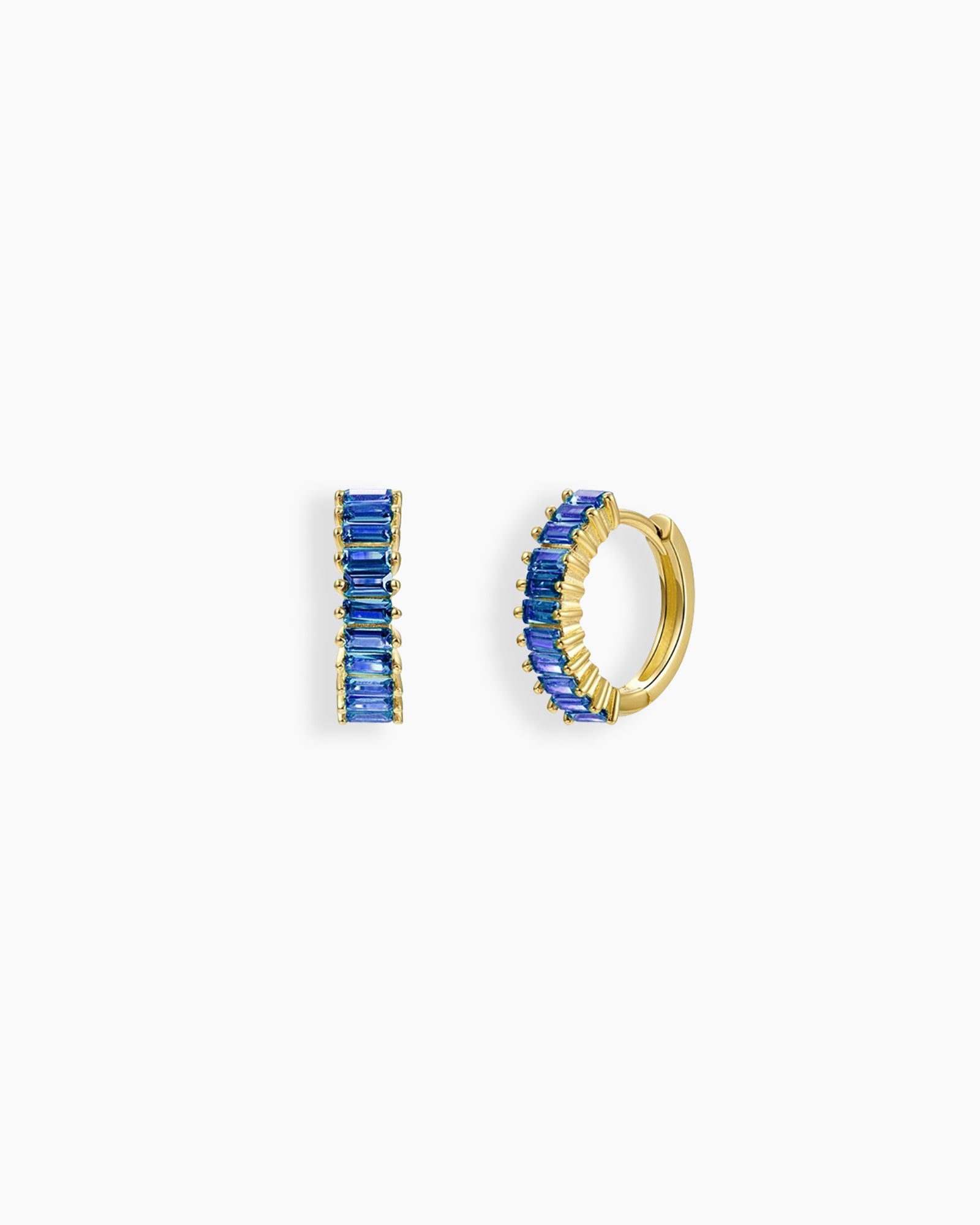 Blue huggie earrings with a row of baguette-cut zircon stones in a sleek channel setting