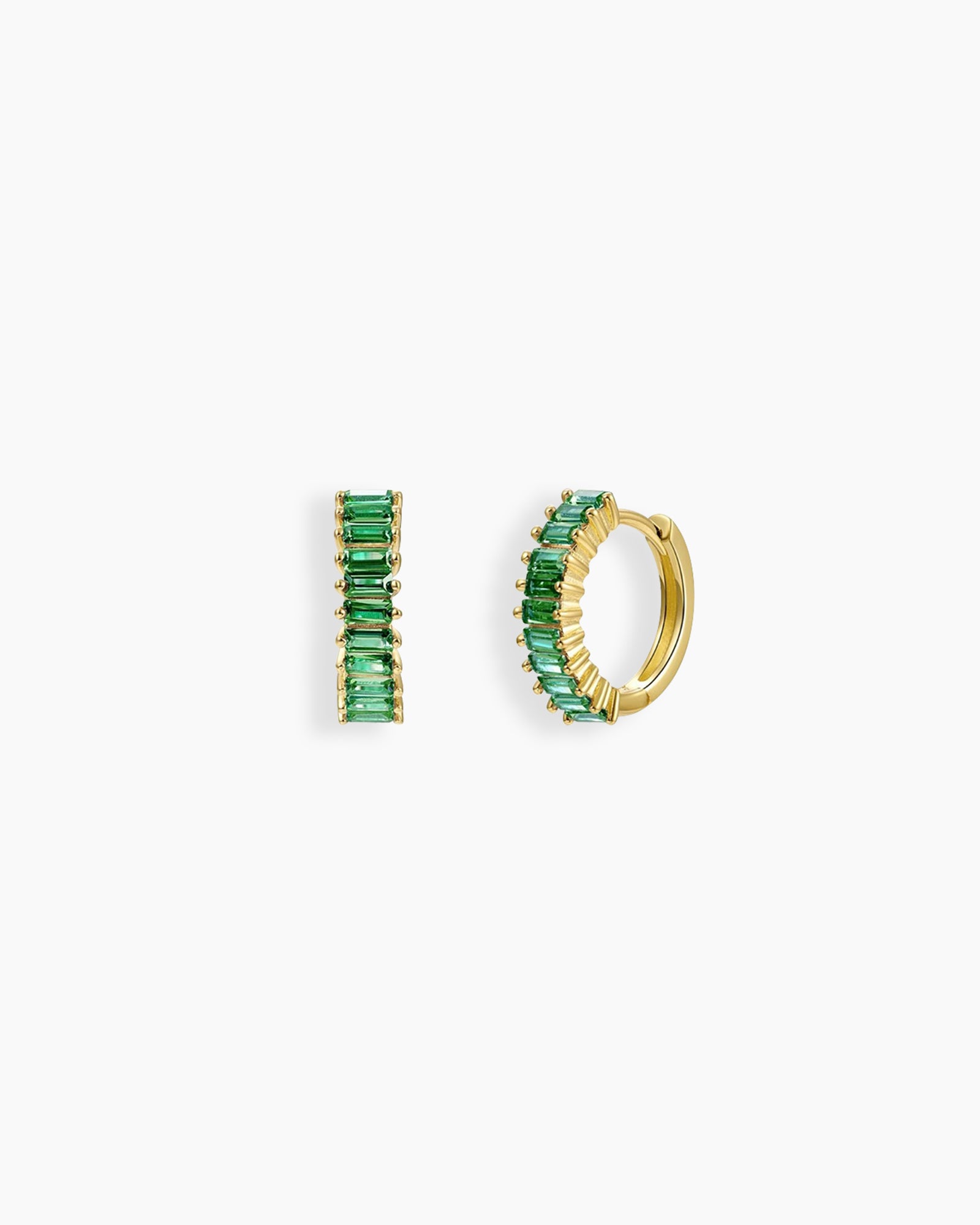 Green huggie earrings with a row of baguette-cut zircon stones in a sleek channel setting