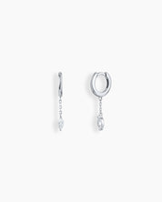 Silver drop earrings with polished huggie hoops, a fine chain drop, and a marquise-cut zircon stone