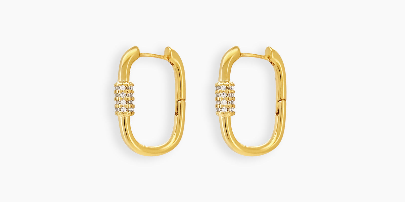 Gold carabiner-style earrings with a bold oval shape and a center band of clear zircon stones