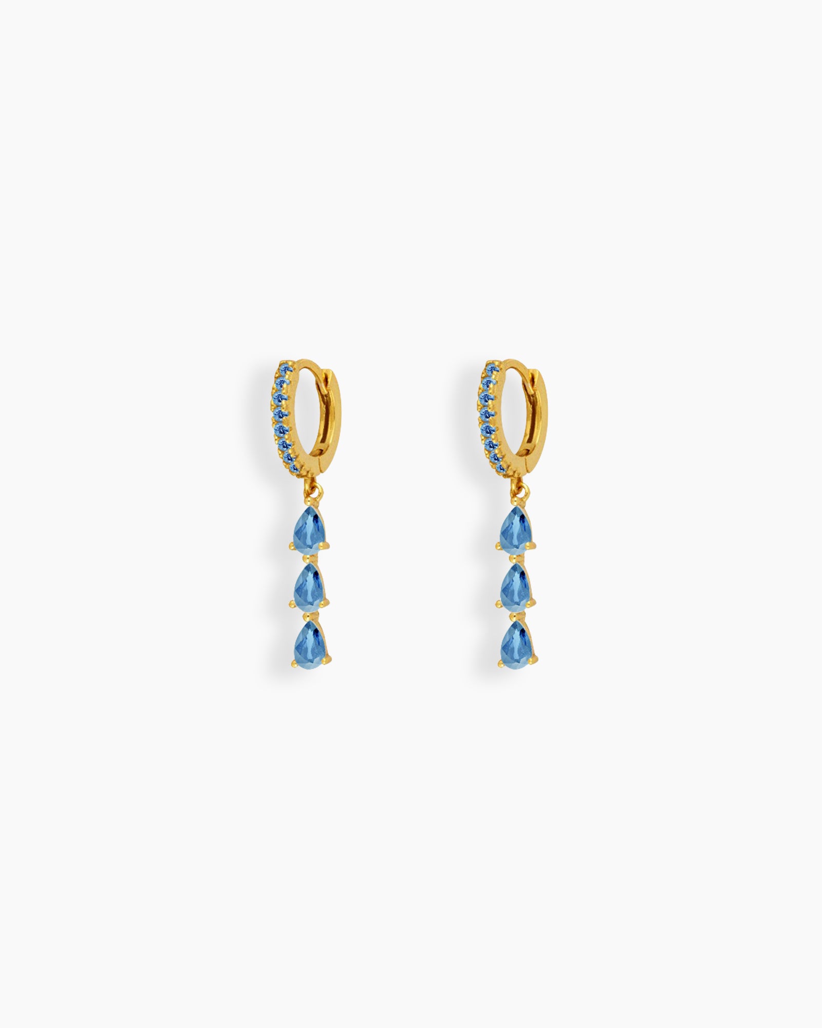 Light-blue drop earrings with three delicately suspended pear-shaped zircon stones that sway gracefully