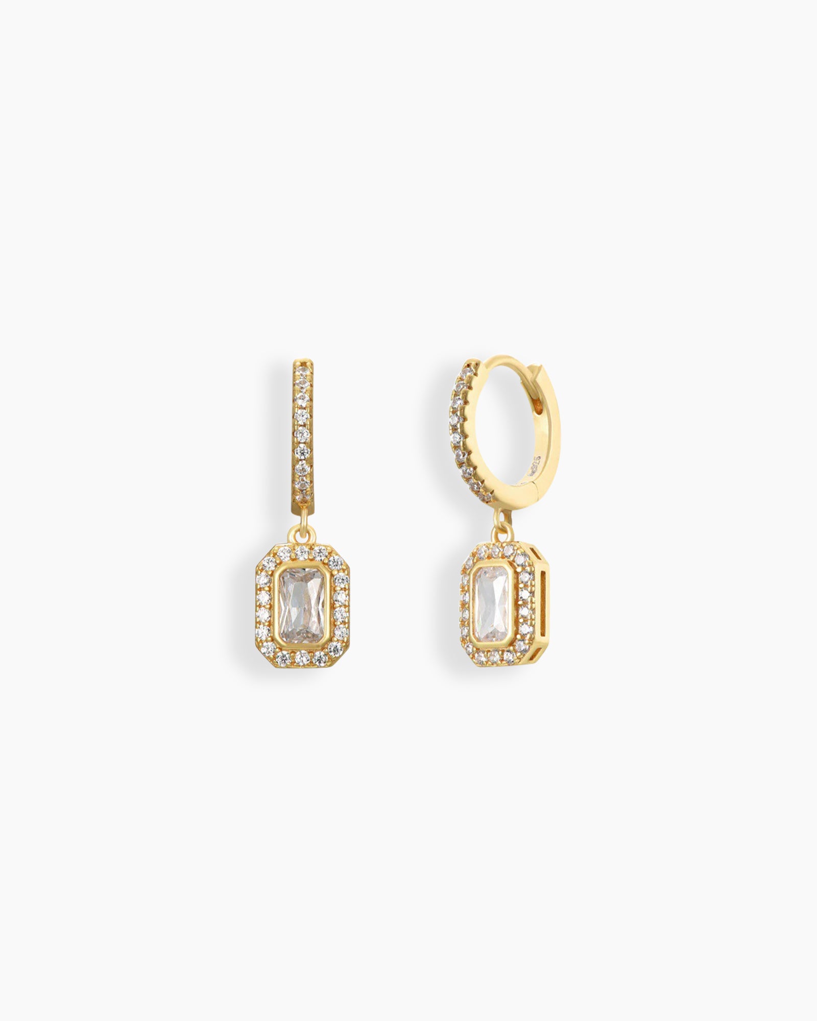 White drop earrings with a radiant emerald-cut zircon stone framed with pavé crystals on a classic gold hoop