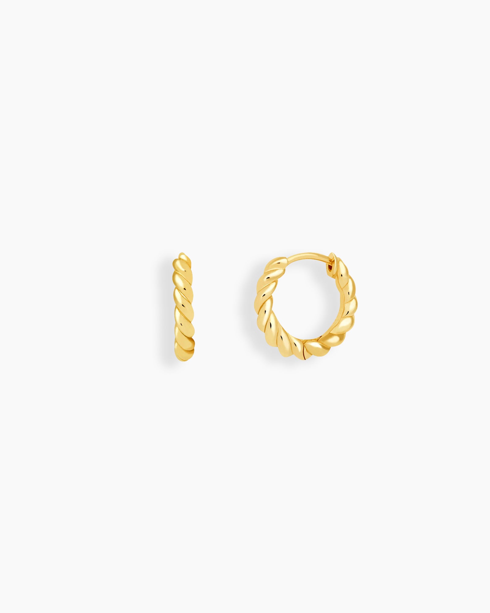 Hoop earrings with a gently sculpted rope design in a polished gold-tone finish for a refined texture