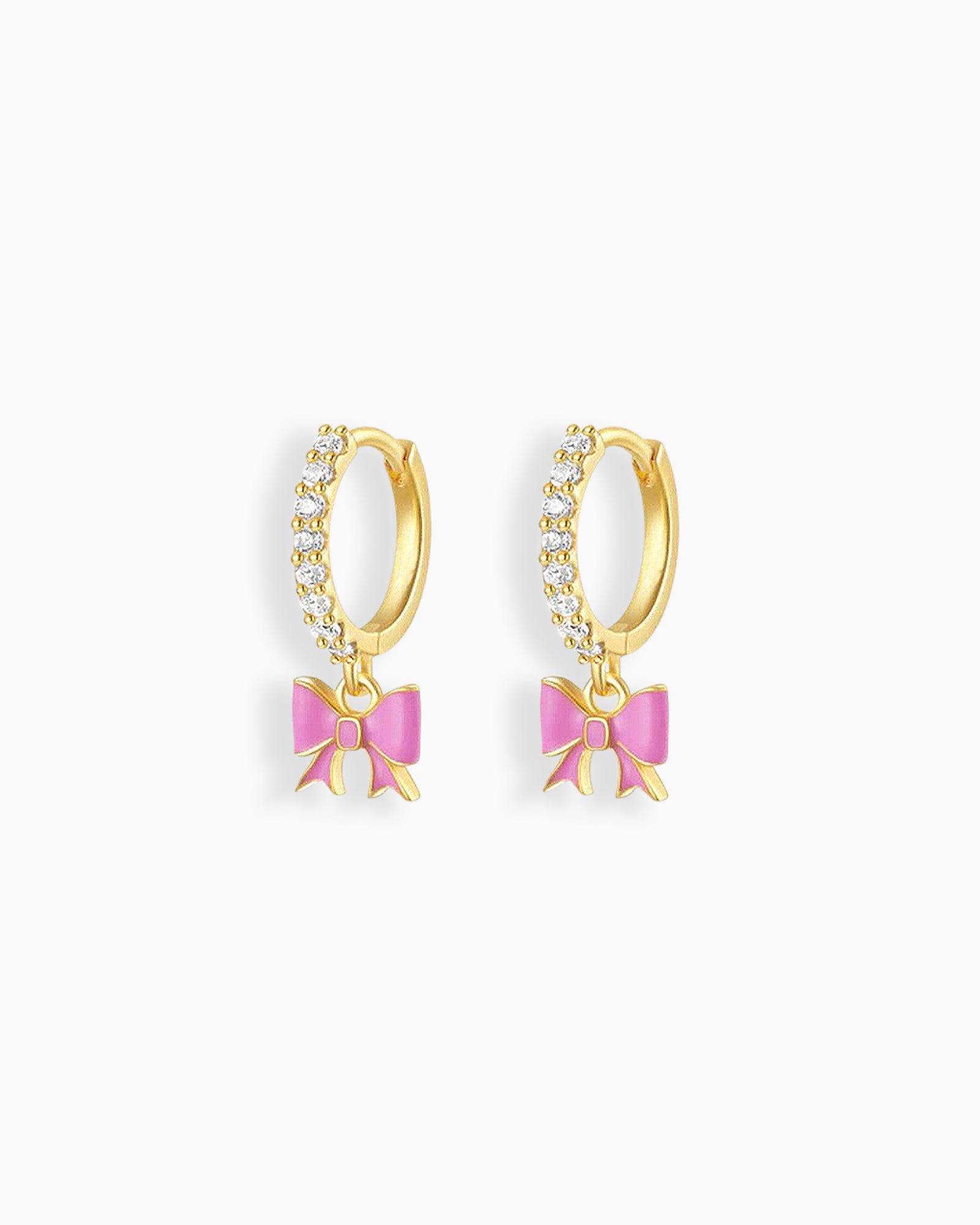 Playful gold hoop earrings with a cascade of cubic zirconia stones and a dangling soft pink enamel bow